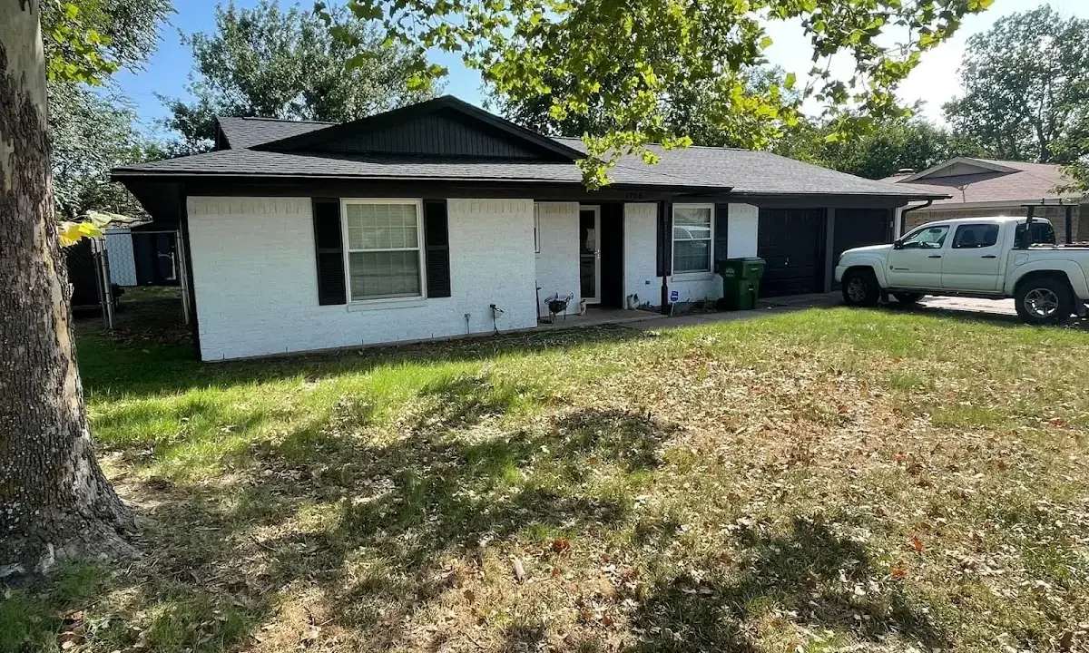 Professional roofing crew working on a residential roof in East Whiteland